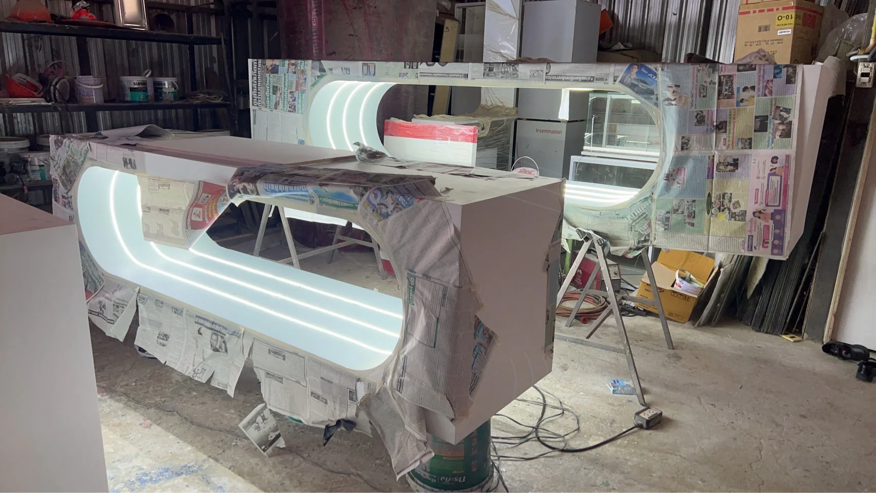 Masked counter components with curved lighting illuminated for checks in the workshop
