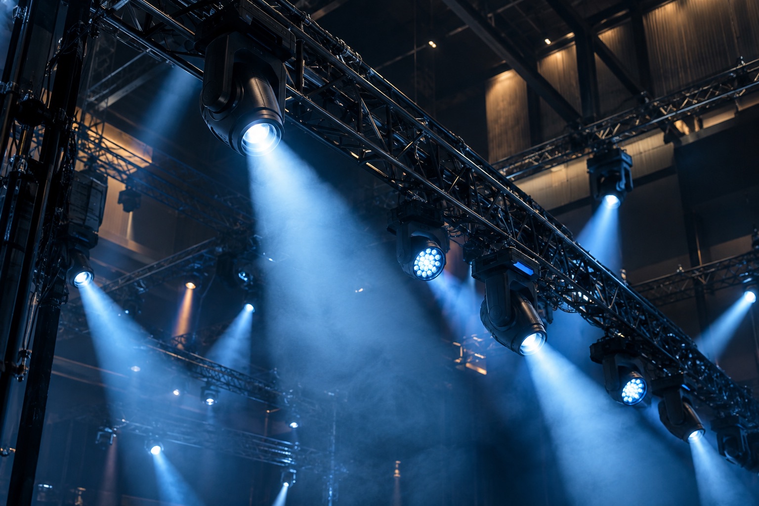Professional lighting truss projecting precise cobalt beams across an event space